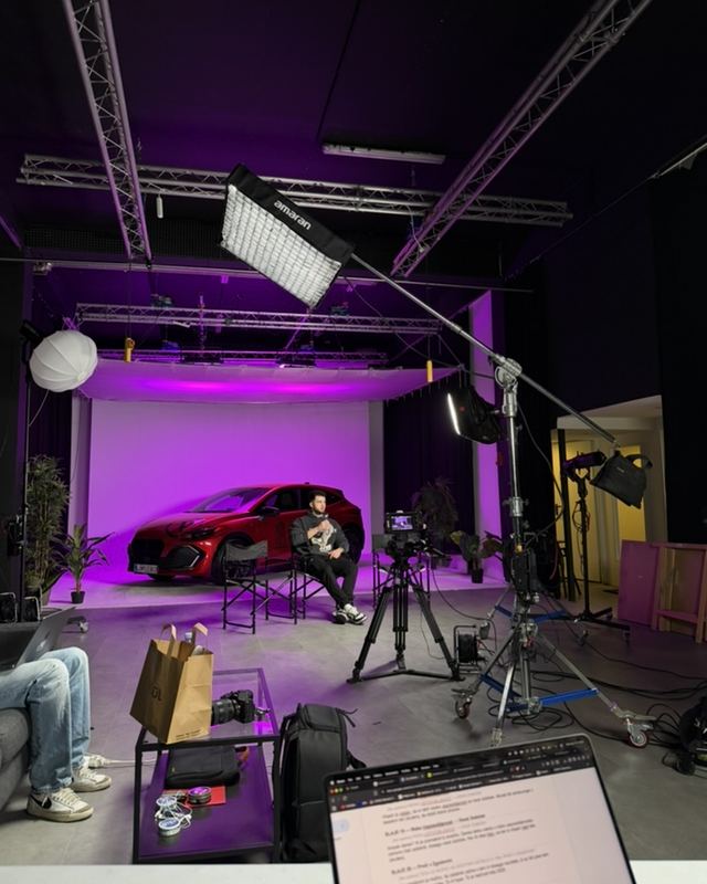 Luka on the set with the campaign car
